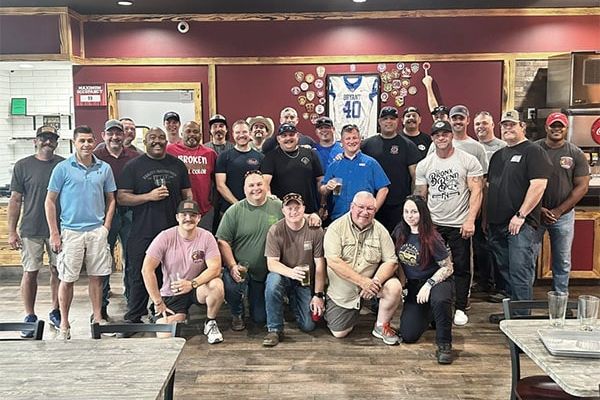 The Kitchen Table foundation gathering for a photo at the local tavern