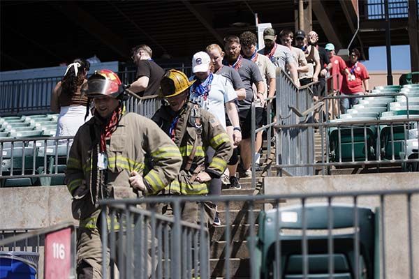 ktf and volunteers climbing the stairs in honor of the fallen fire fighters on 9-11